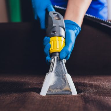 High-powered vacuuming for leather upholstery cleaning preparation